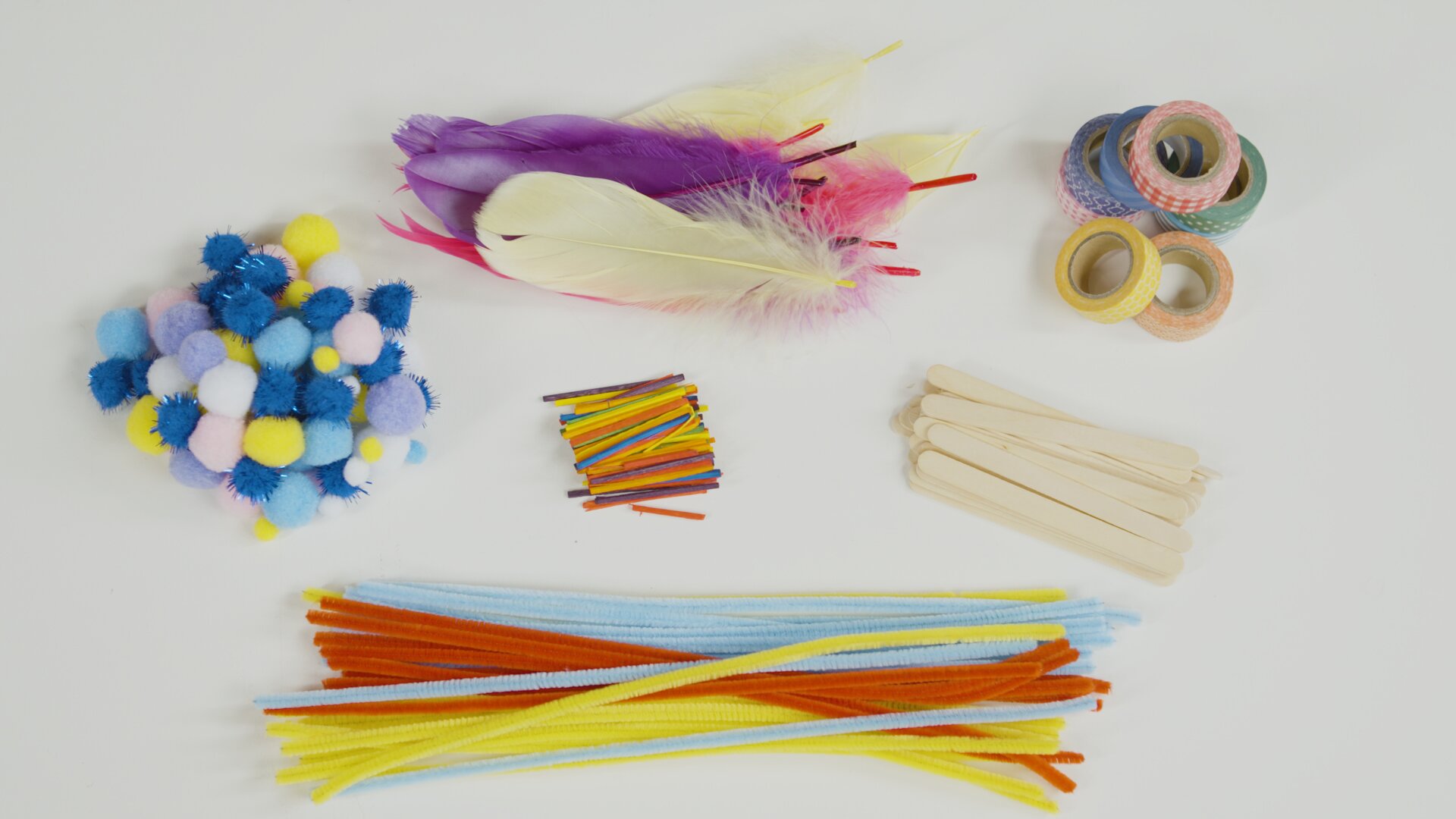 Coloured pom poms, pipe cleaners, feathers, washi tape & matchsticks