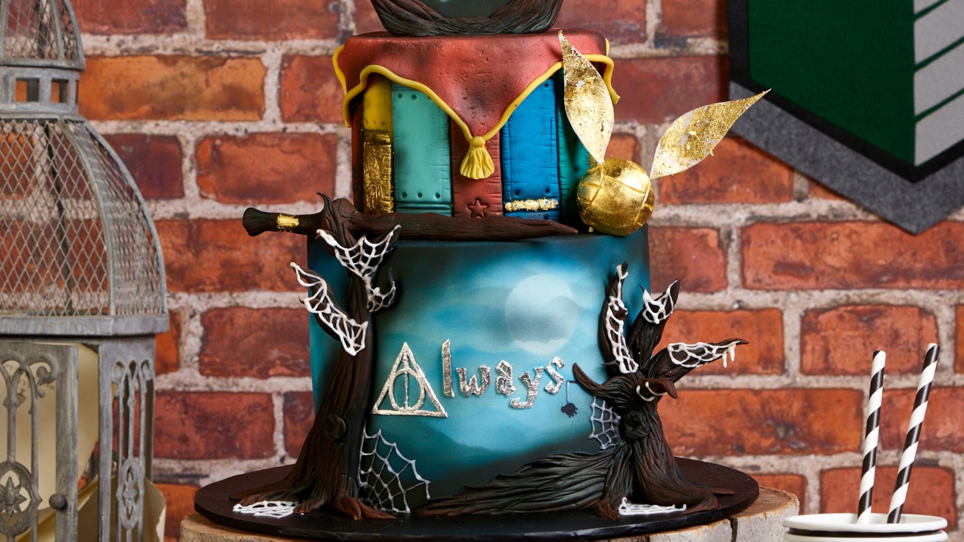 2 Tier Harry Potter themed cake with quidditch, magic wand and forbidden forest fondant decorations