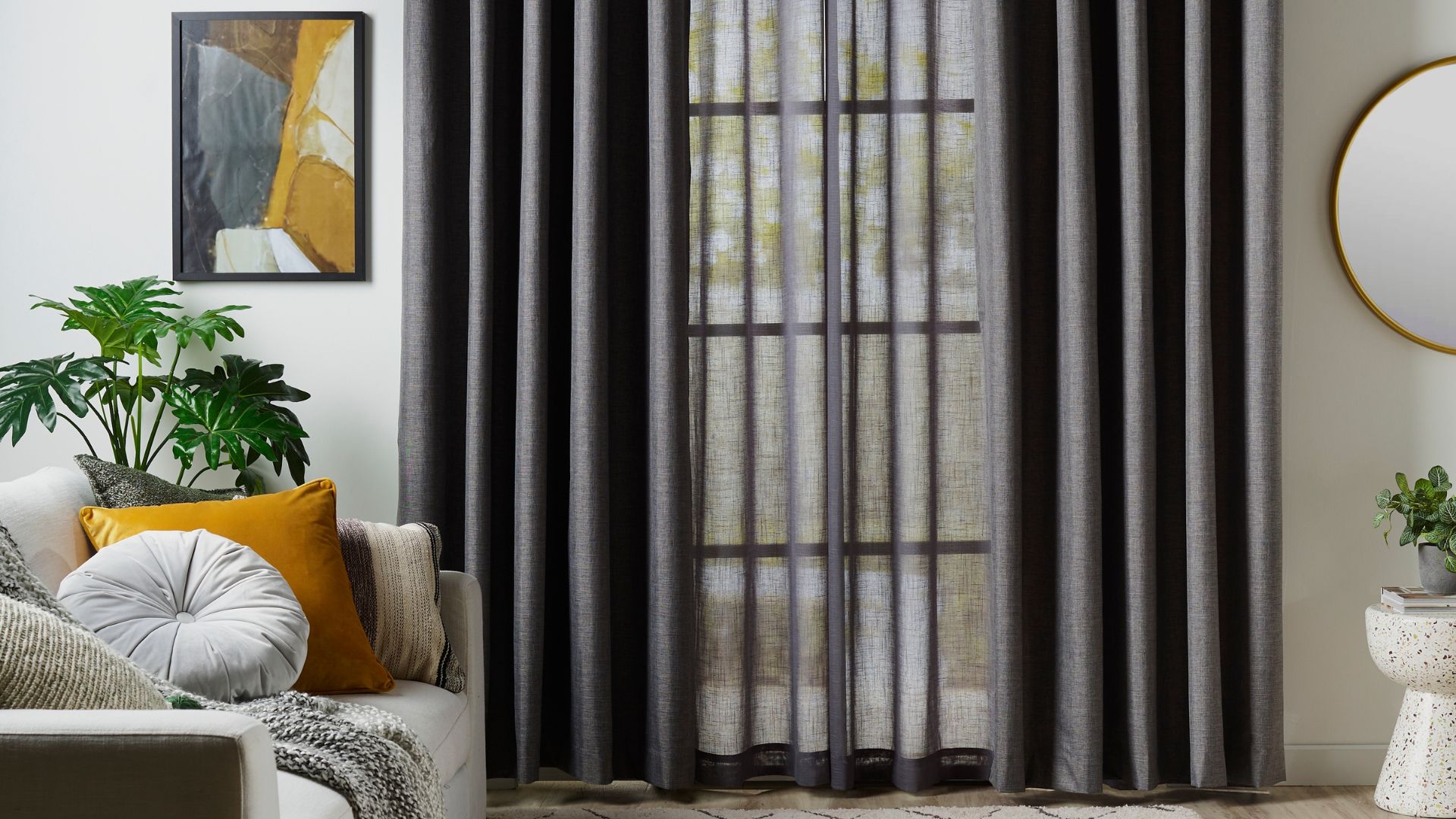 Sheer dark grey curtains layered with blockout curtains